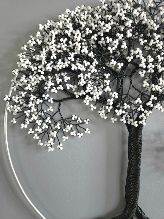 Decorative tree with white berries on a plain background