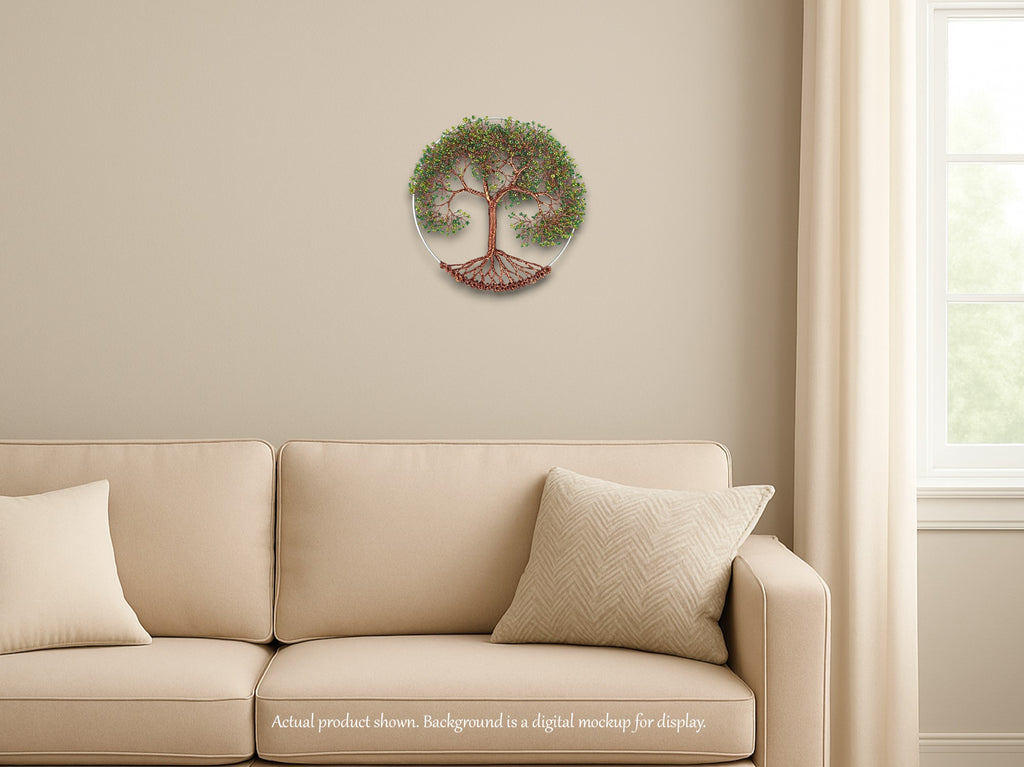 Decorative wall clock with tree design on a beige wall above a beige sofa.