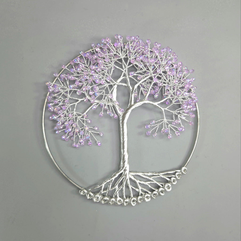 Decorative wall art of a tree with purple beads on a gray background