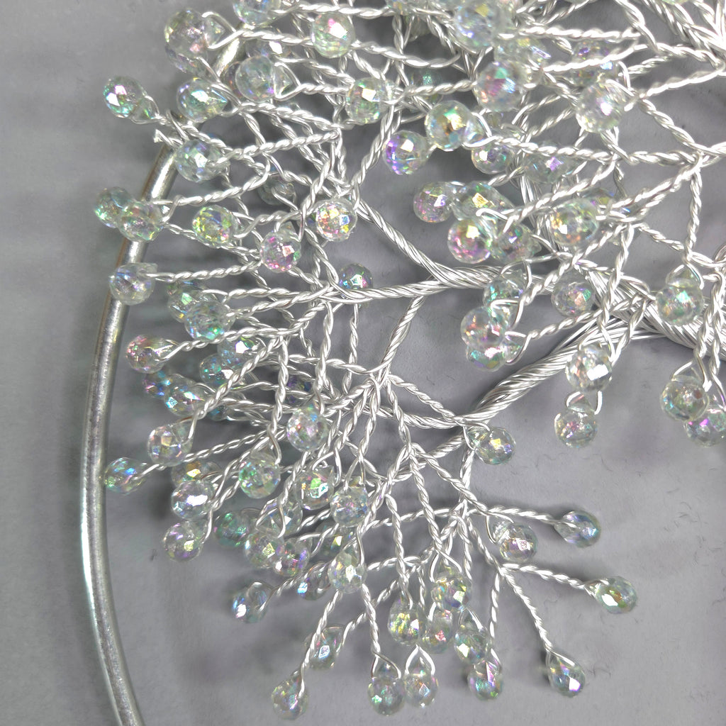 Silver hair vine with beads on a gray background