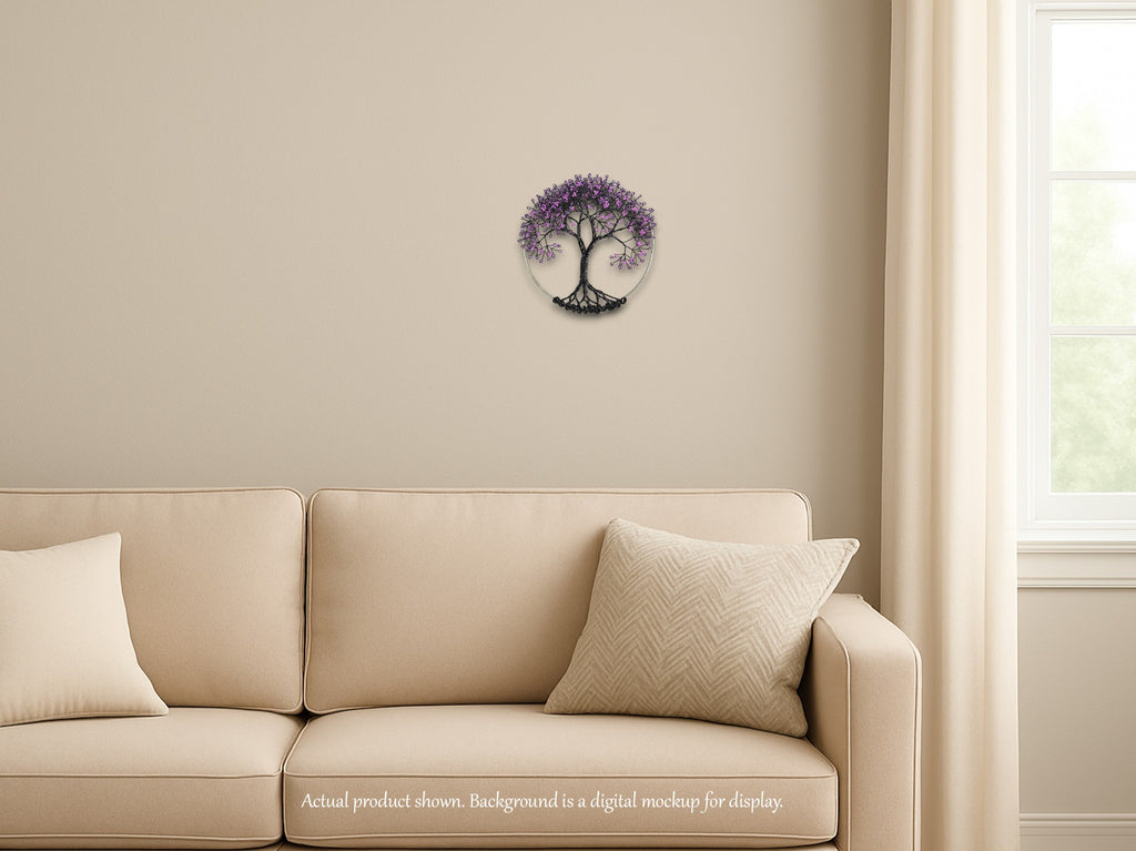 Beige sofa with decorative pillows in a room with a wall clock featuring a tree design.
