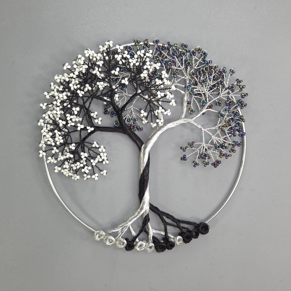 Decorative wall art in the shape of a tree with branches on a gray background