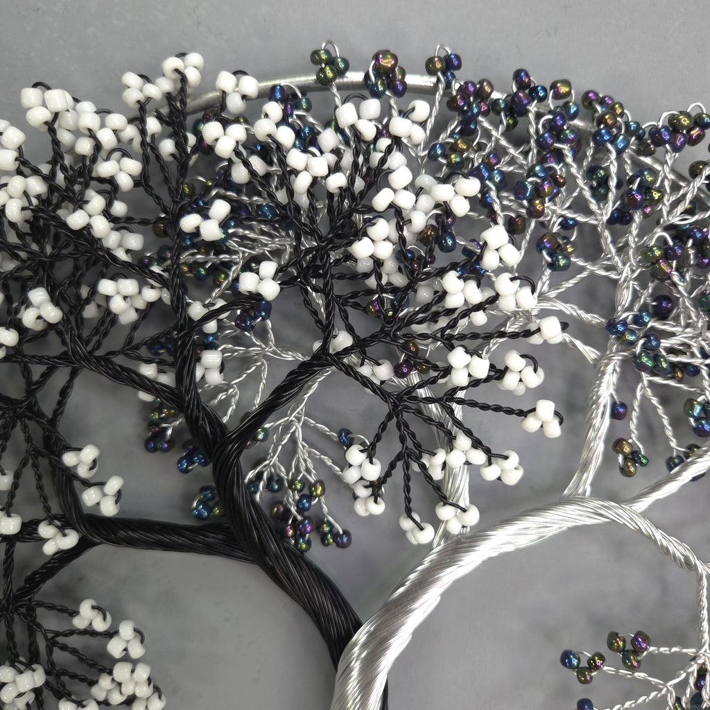 Decorative tree with beaded branches on a gray background