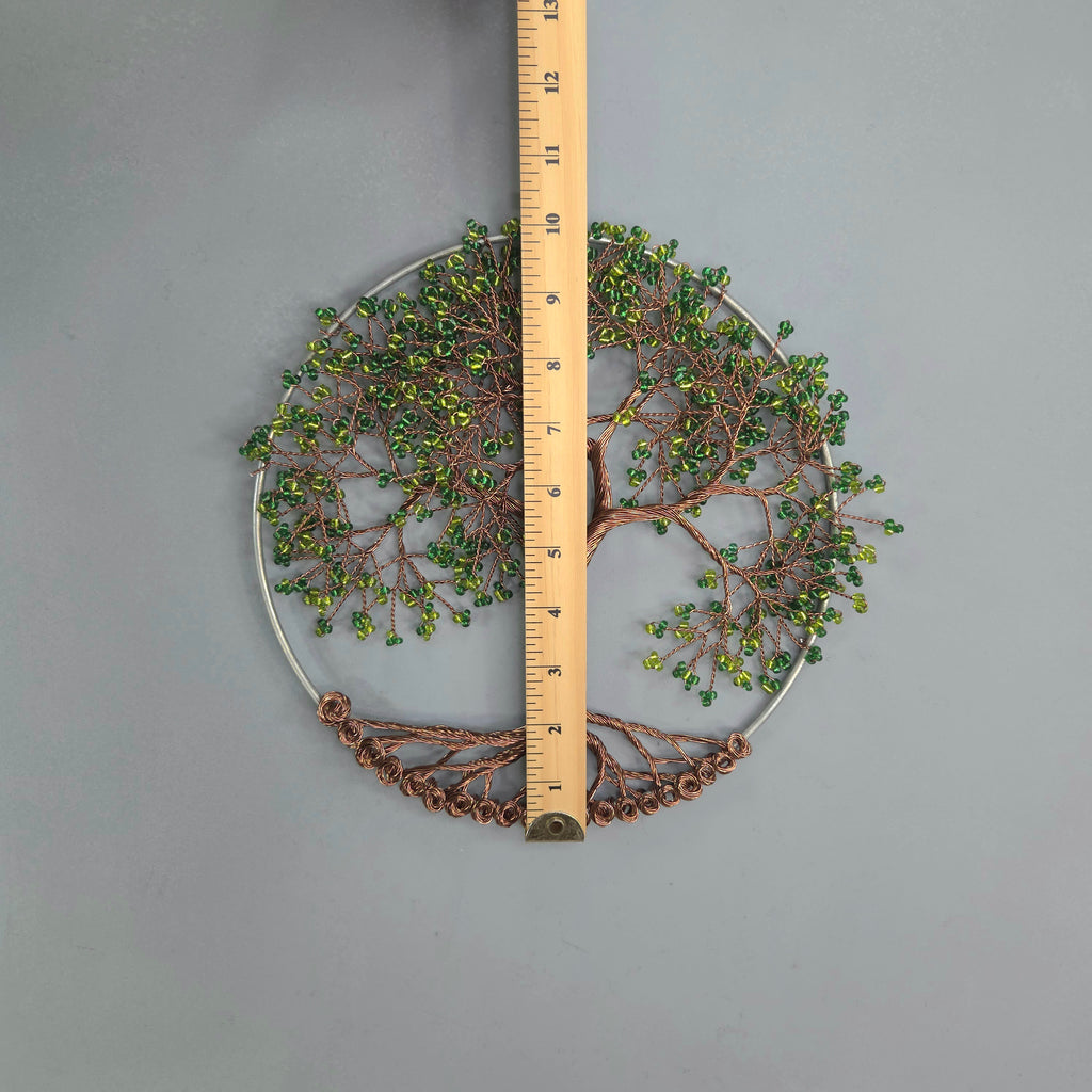 Decorative circular wall art with a ruler for scale on a gray background