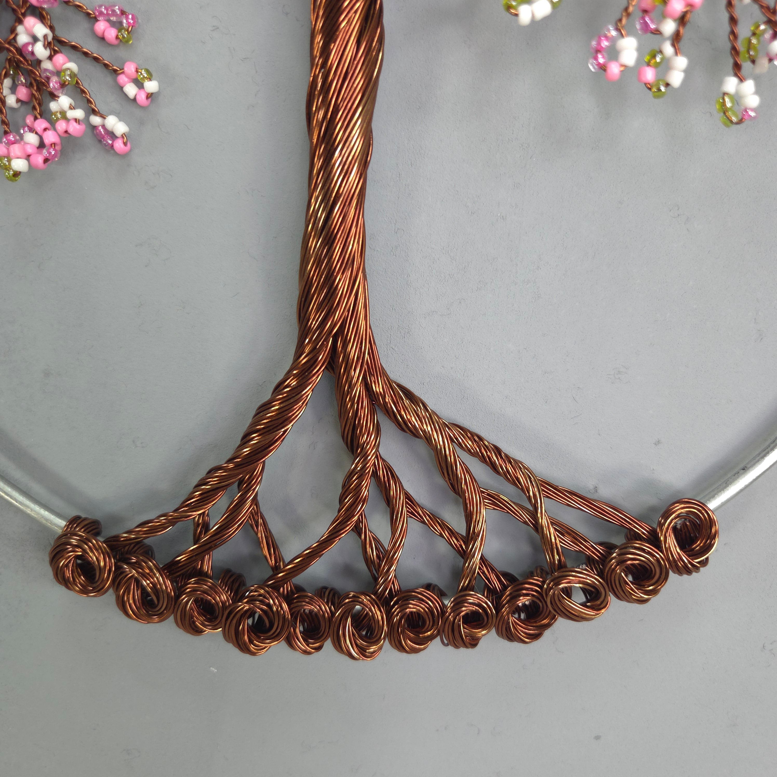 Close-up of a copper wire hair accessory on a gray background
