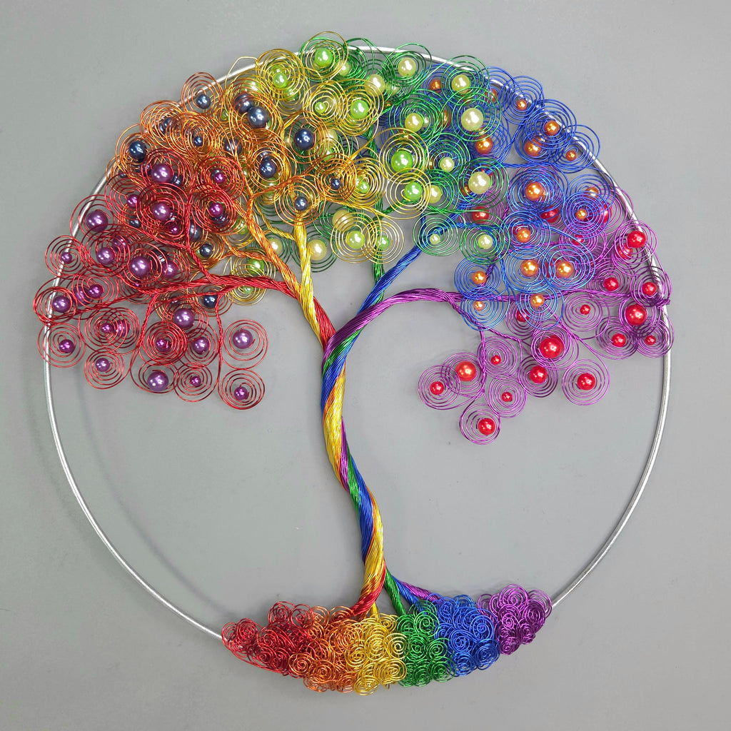 Colorful tree-shaped decorative item with beads on a gray background
