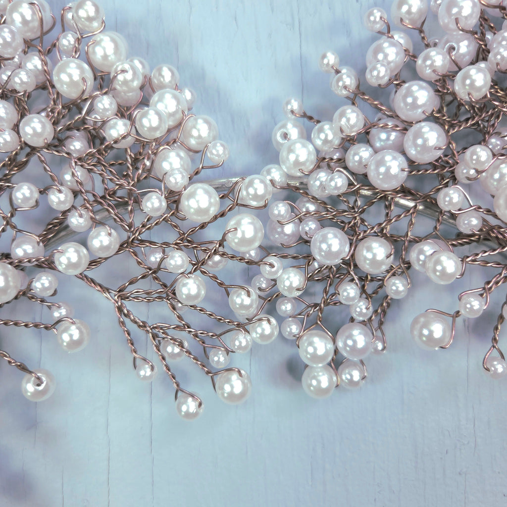 Pearl hair vine on a light blue background