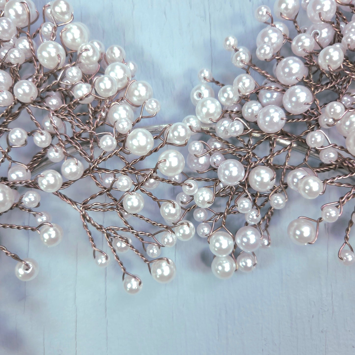Pearl hair vine on a light blue background