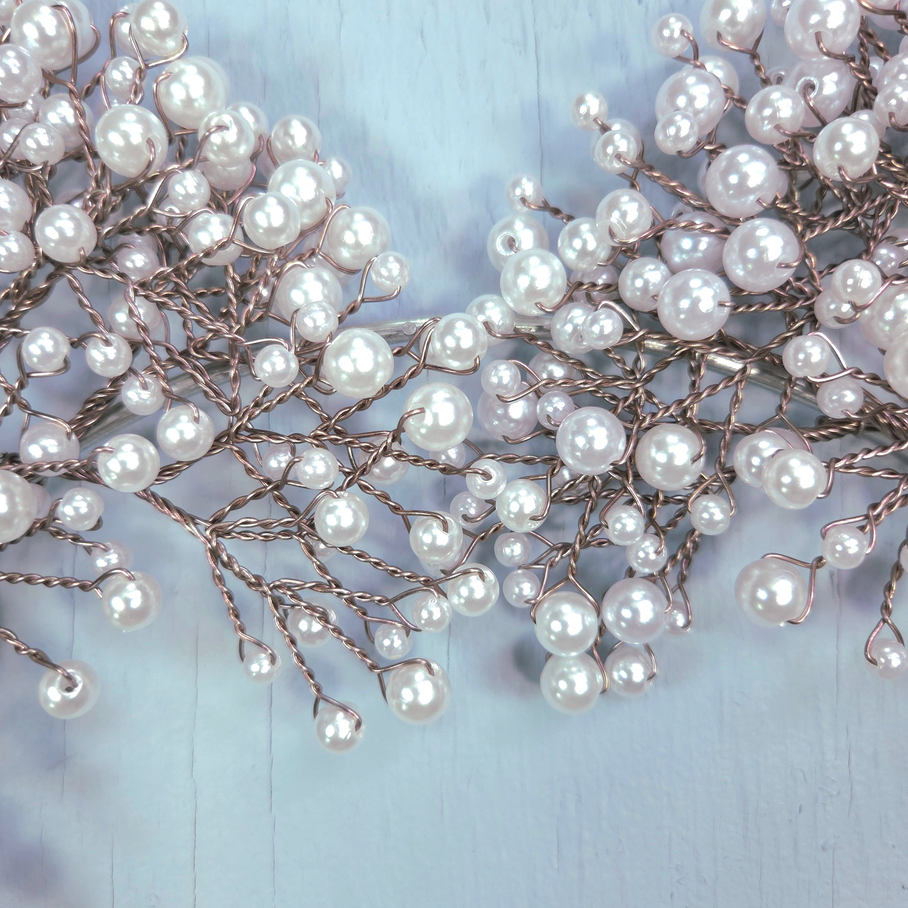 Pearl hair vine on a light blue background