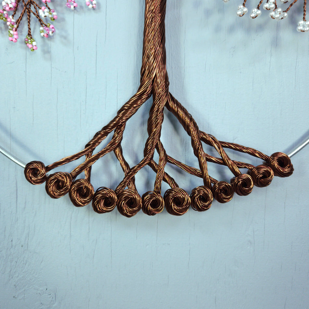 Close-up of a braided brown cord on a light blue background
