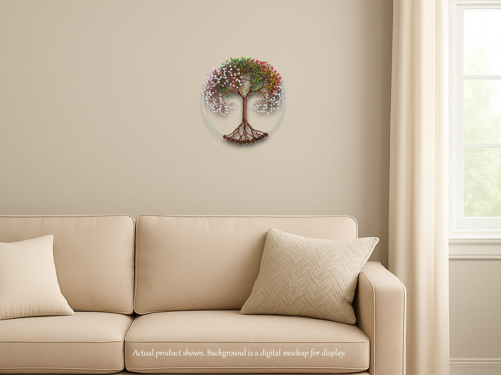 Decorative wall clock with tree design on a beige wall above a beige sofa.