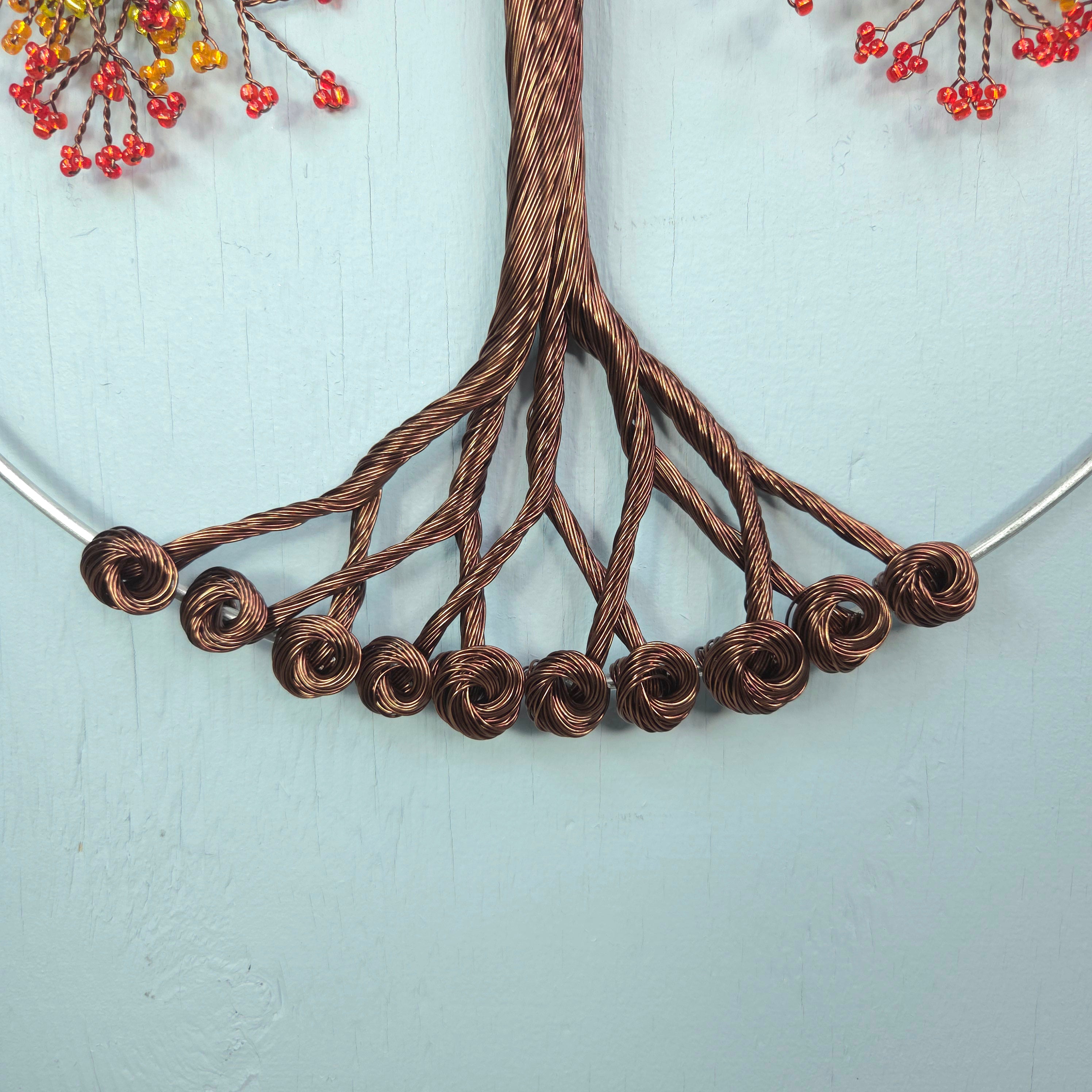 Necklace with brown wire roses on a light blue background