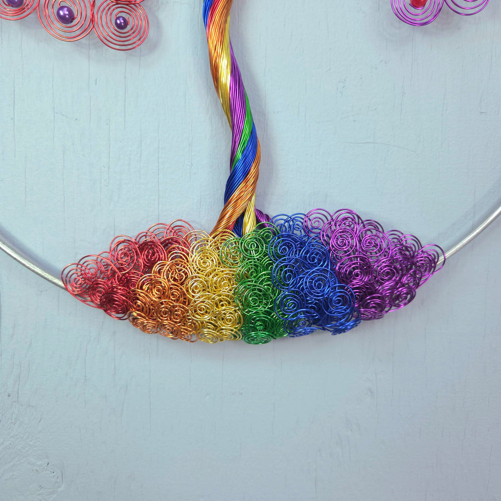 Colorful wire necklace on a light gray background