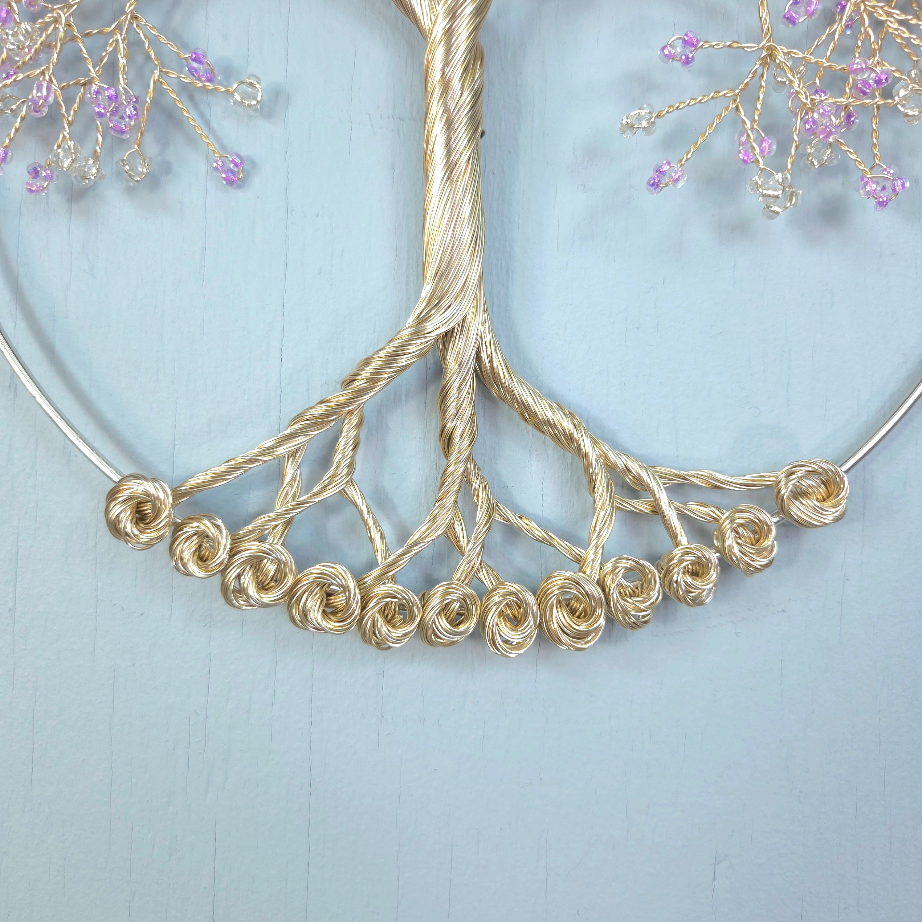 Gold necklace with floral design on a light blue background