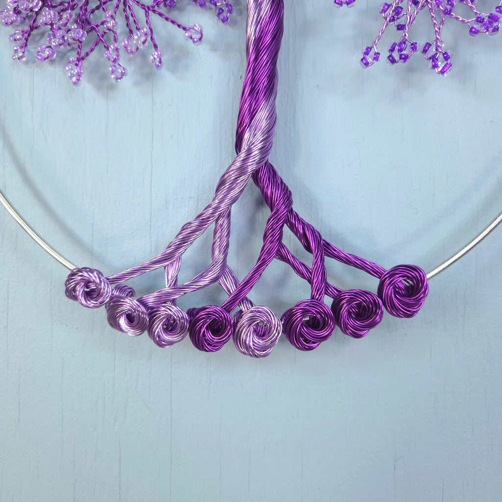 Purple wire necklace on a light blue background