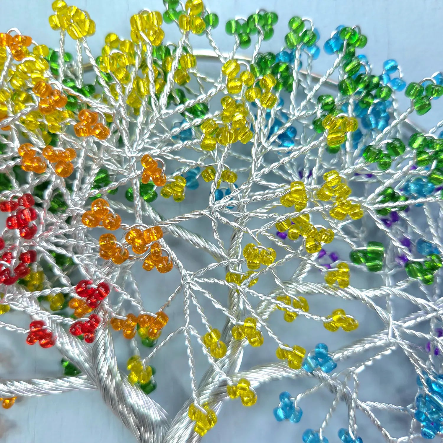 Close-up of colorful bead embroidery on fabric