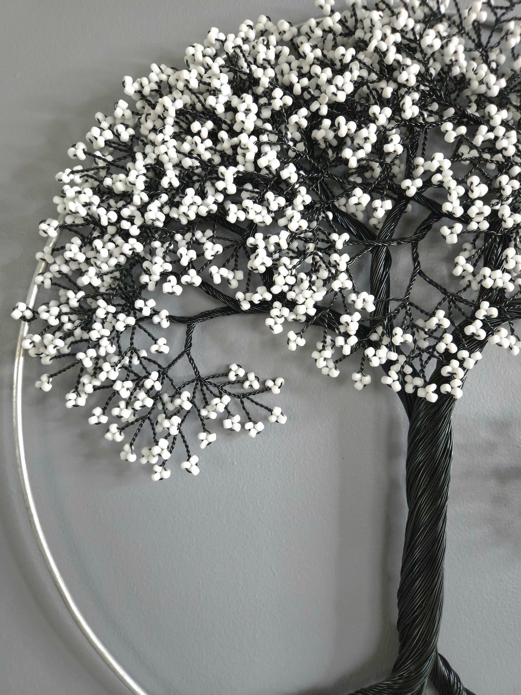 Decorative tree with white berries on a plain background