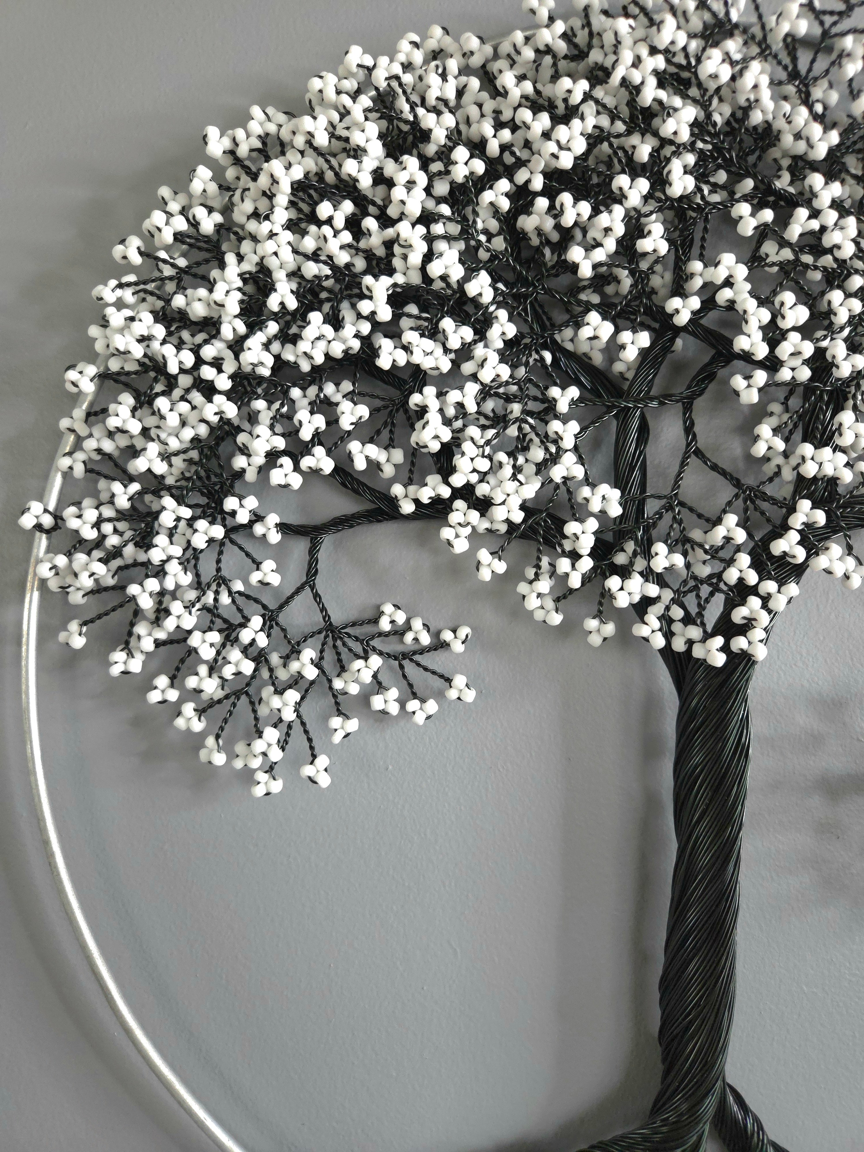 Decorative tree with white berries on a plain background