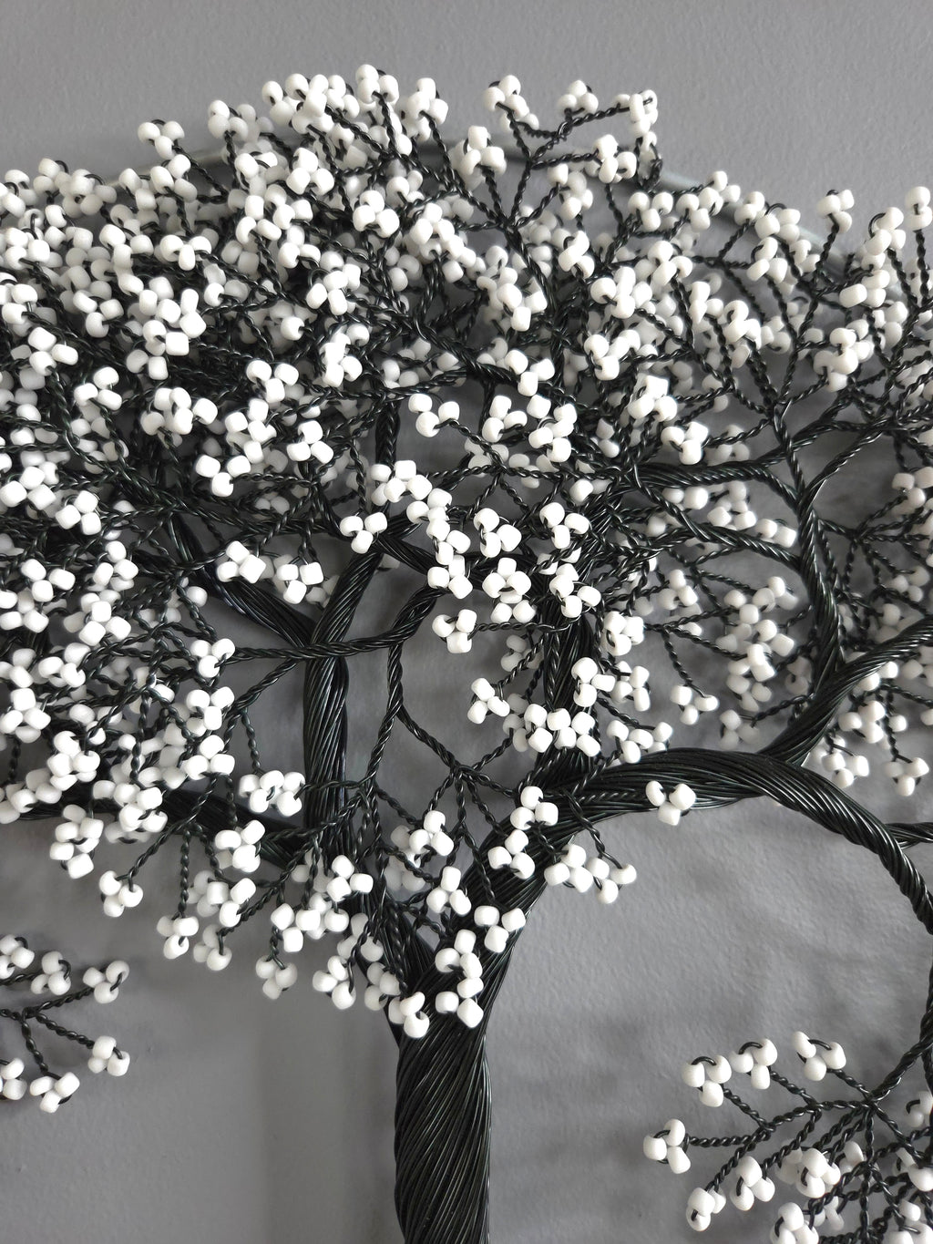 Decorative wreath with white berries on a gray background