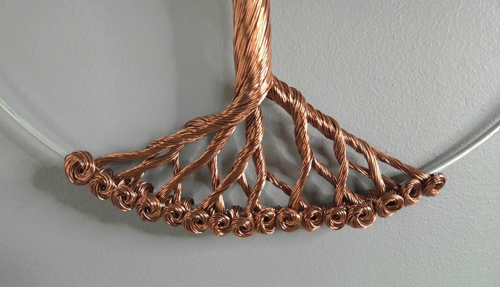 Decorative wall art of a tree on a plain background