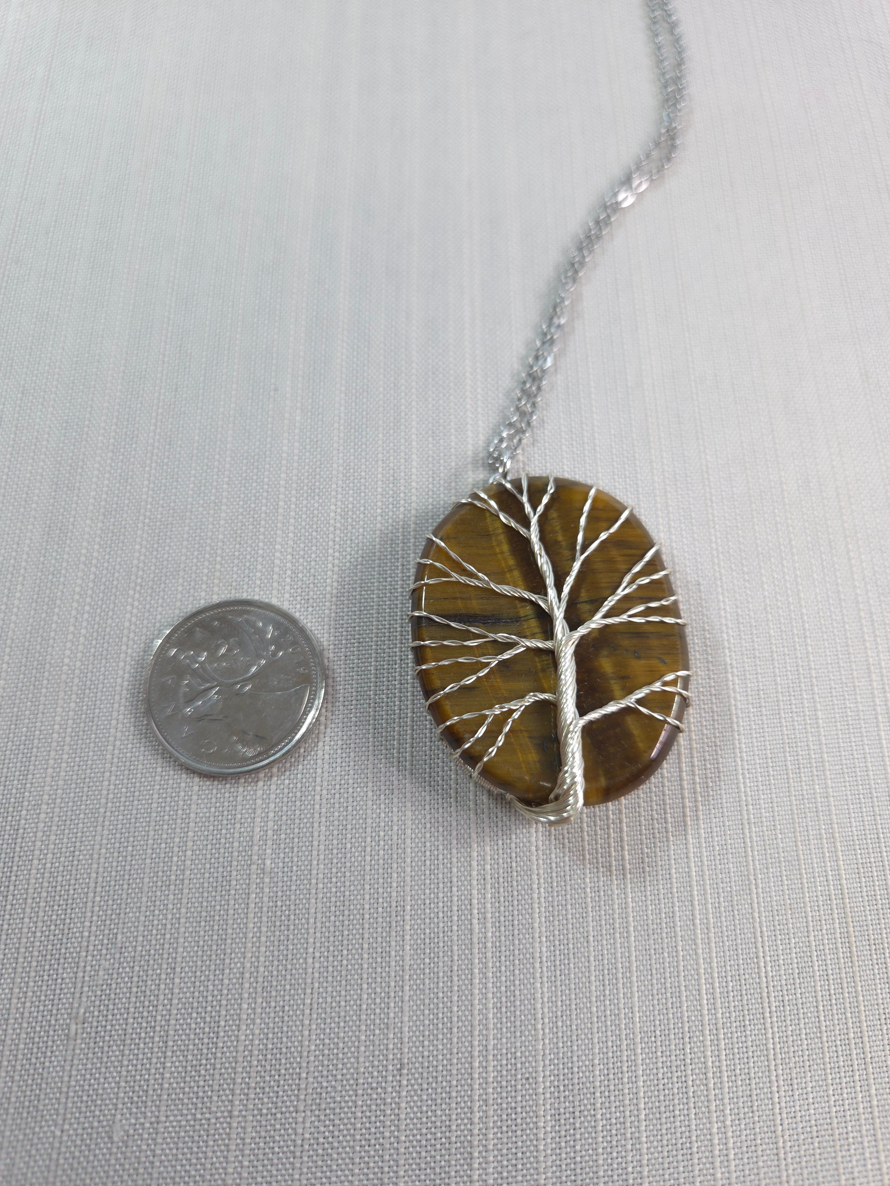 Necklace with a circular pendant on a light gray background