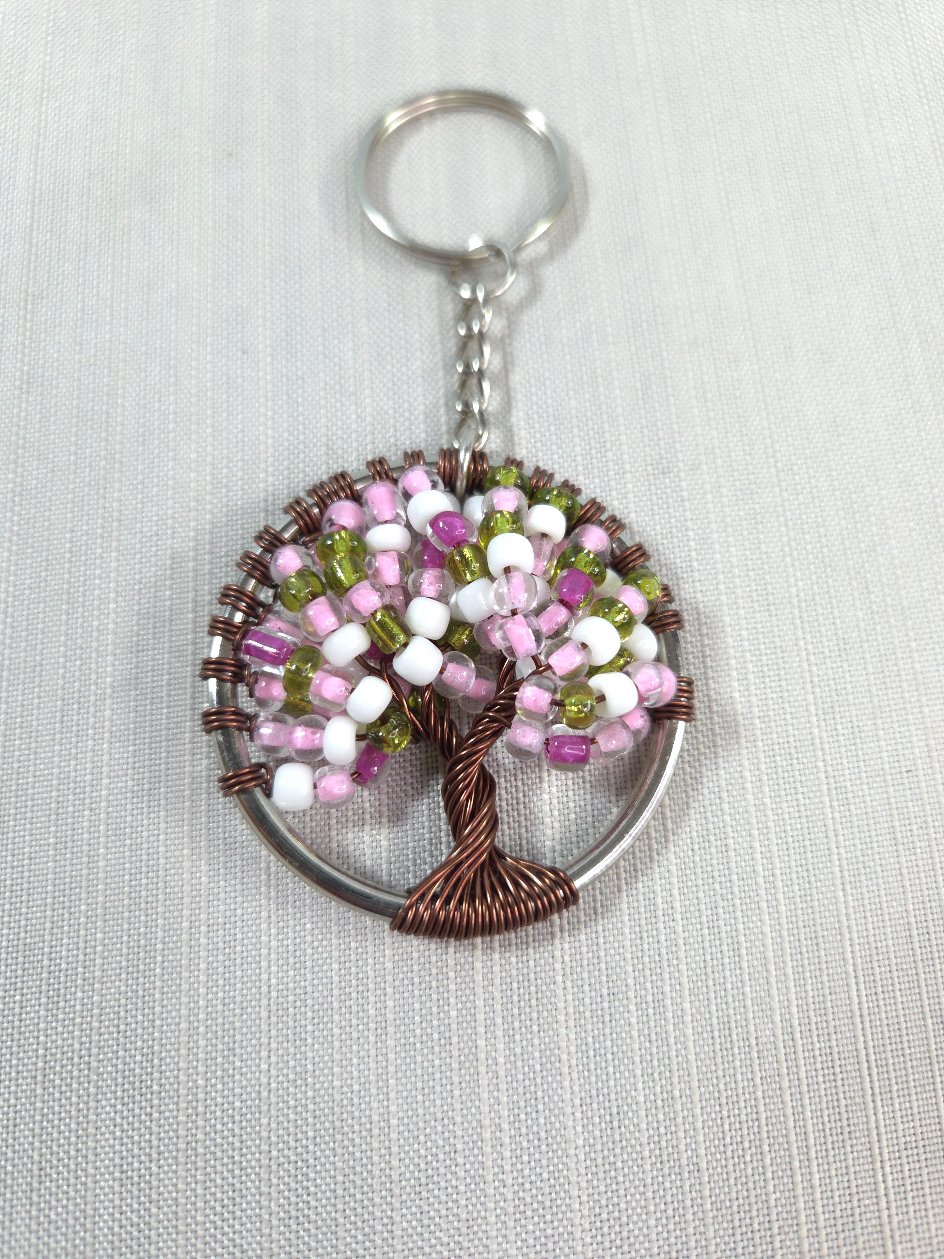 Keychain with beaded tree design on a white background