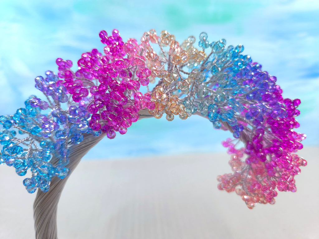Colorful beaded headband with a blurred natural background