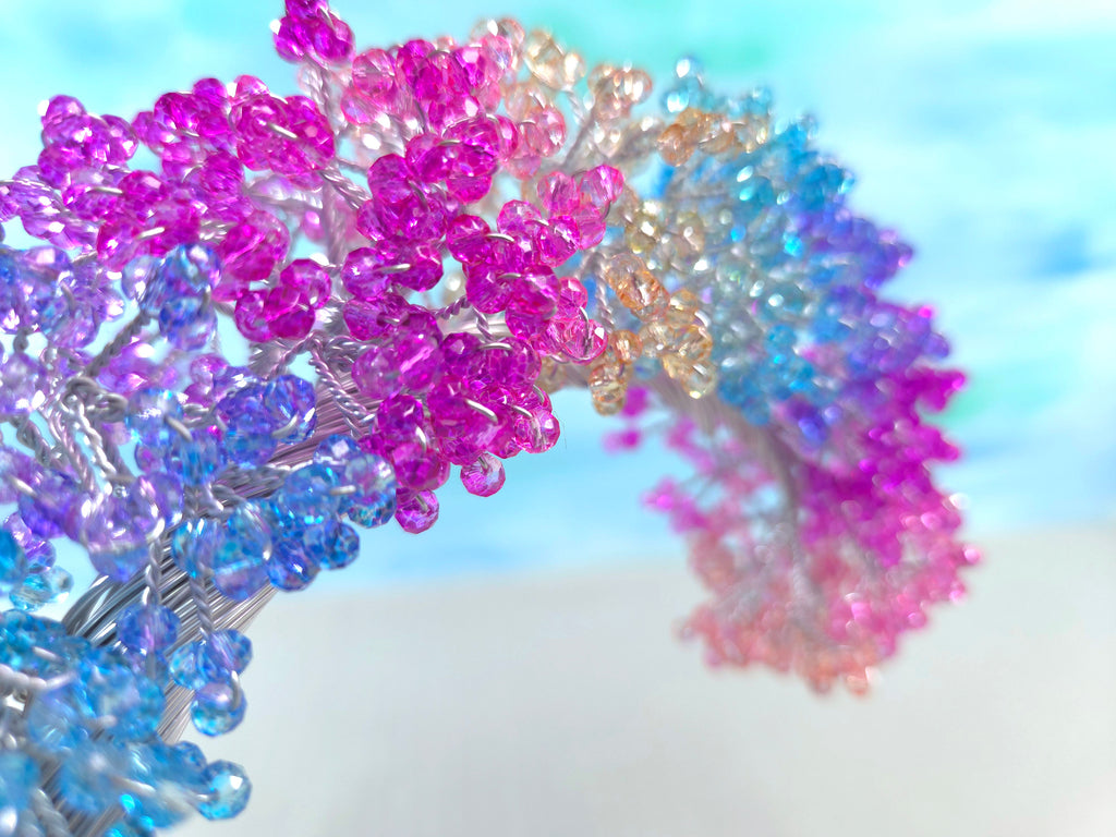 Colorful beaded hair accessories on a white background