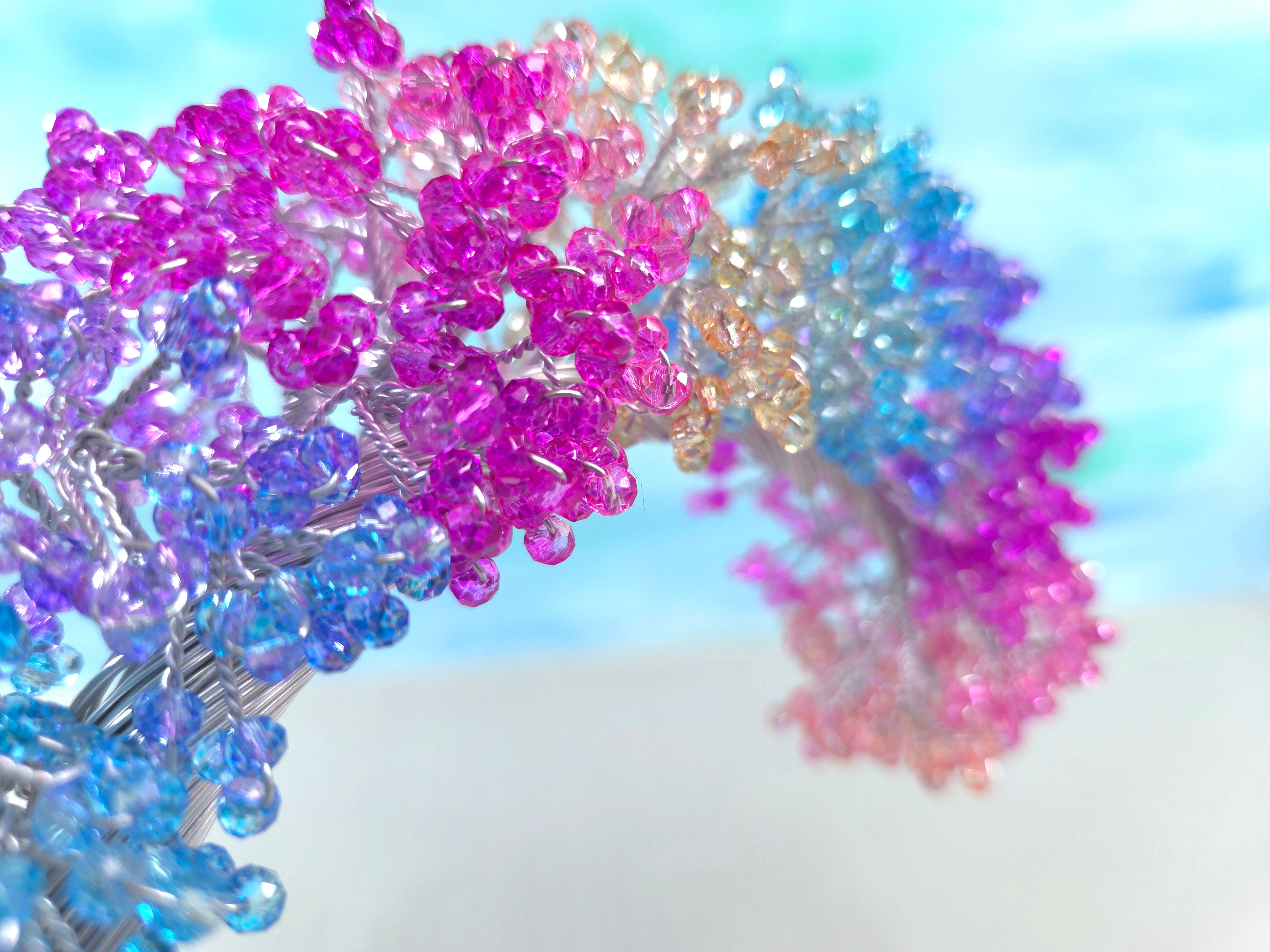 Colorful beaded hair accessories on a white background