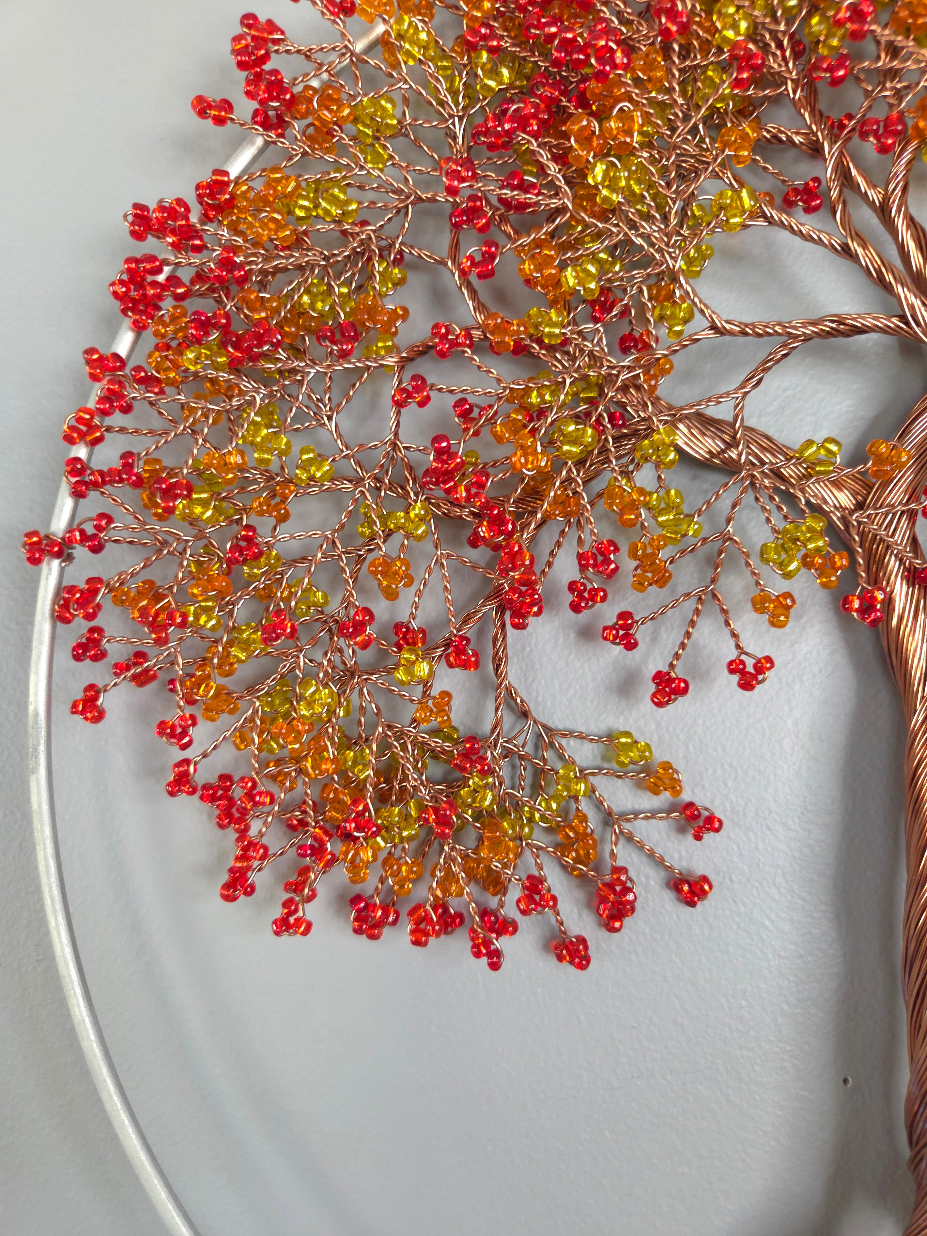 Decorative wreath with red and yellow berries on a white background