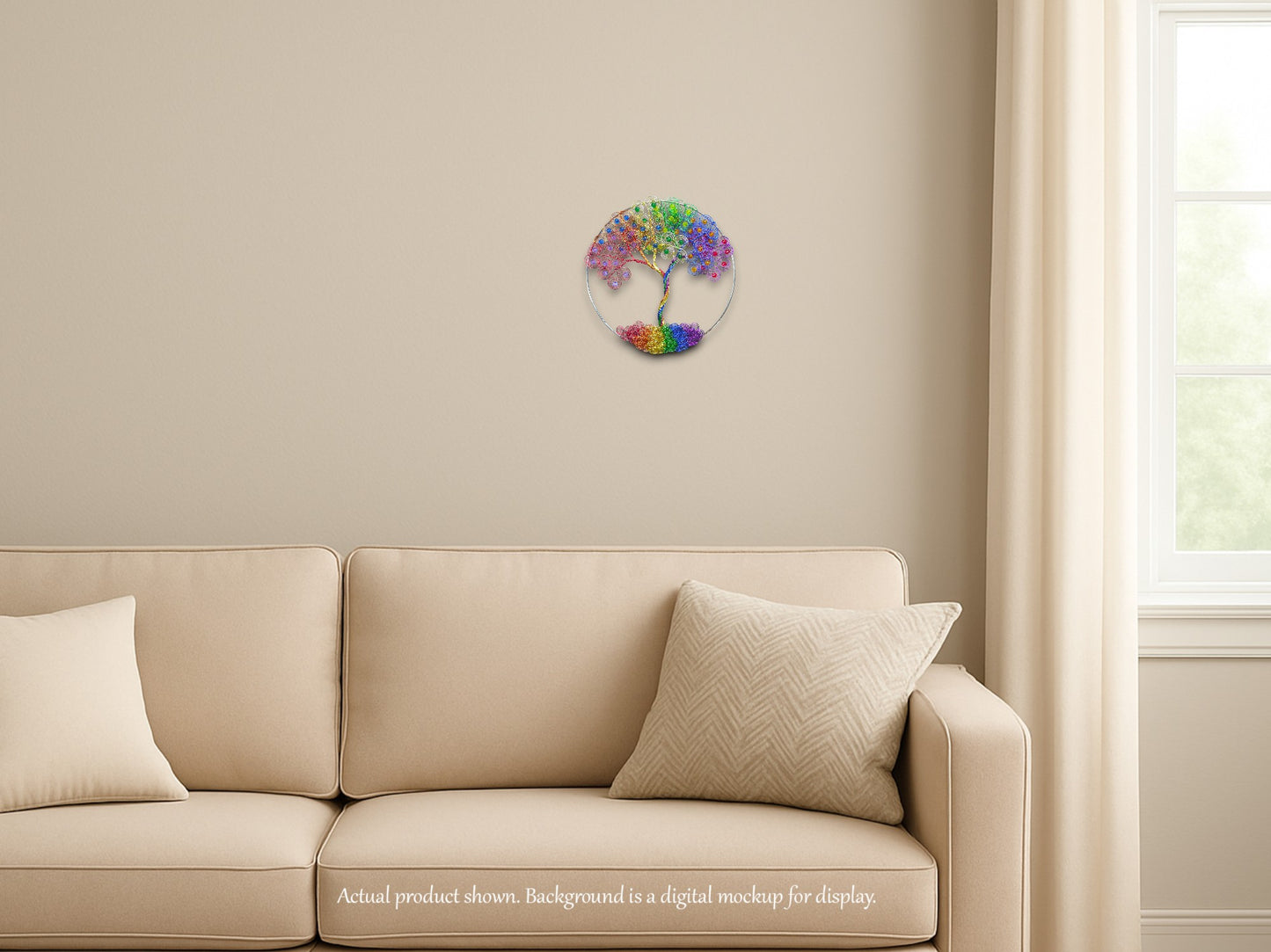 Beige sofa with decorative cushions against a beige wall with a tree of life wall art.