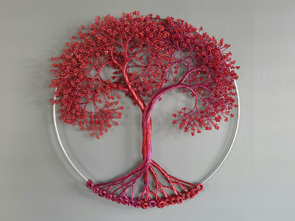 Decorative wall art of a red tree with a gray background