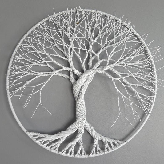 Decorative wall art of a tree with roots and branches on a gray background