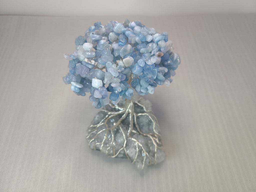 Decorative blue stone tree on a neutral background