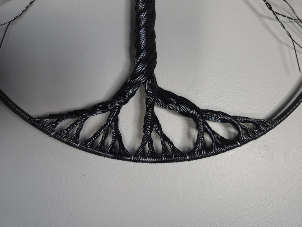 Black woven pattern on a white background