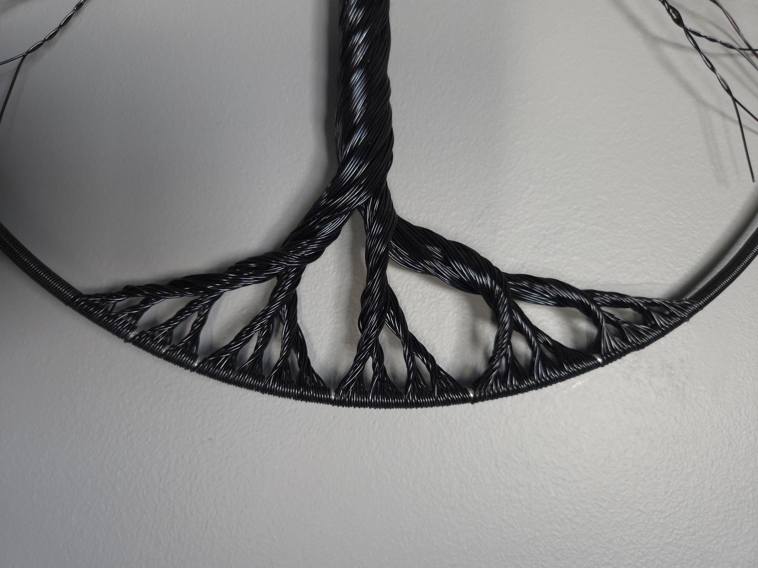 Black woven pattern on a white background