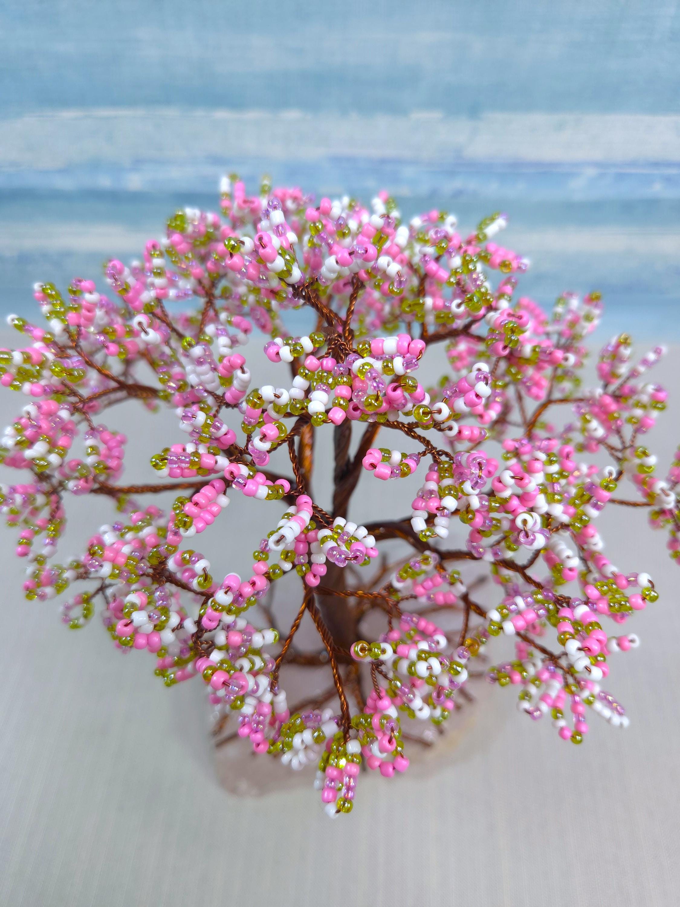 Artificial pink and white floral arrangement on a blurred background
