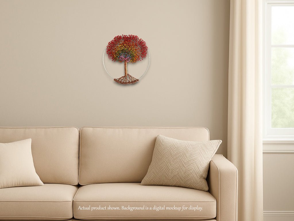 Decorative wall clock with tree design on a beige wall above a beige sofa.