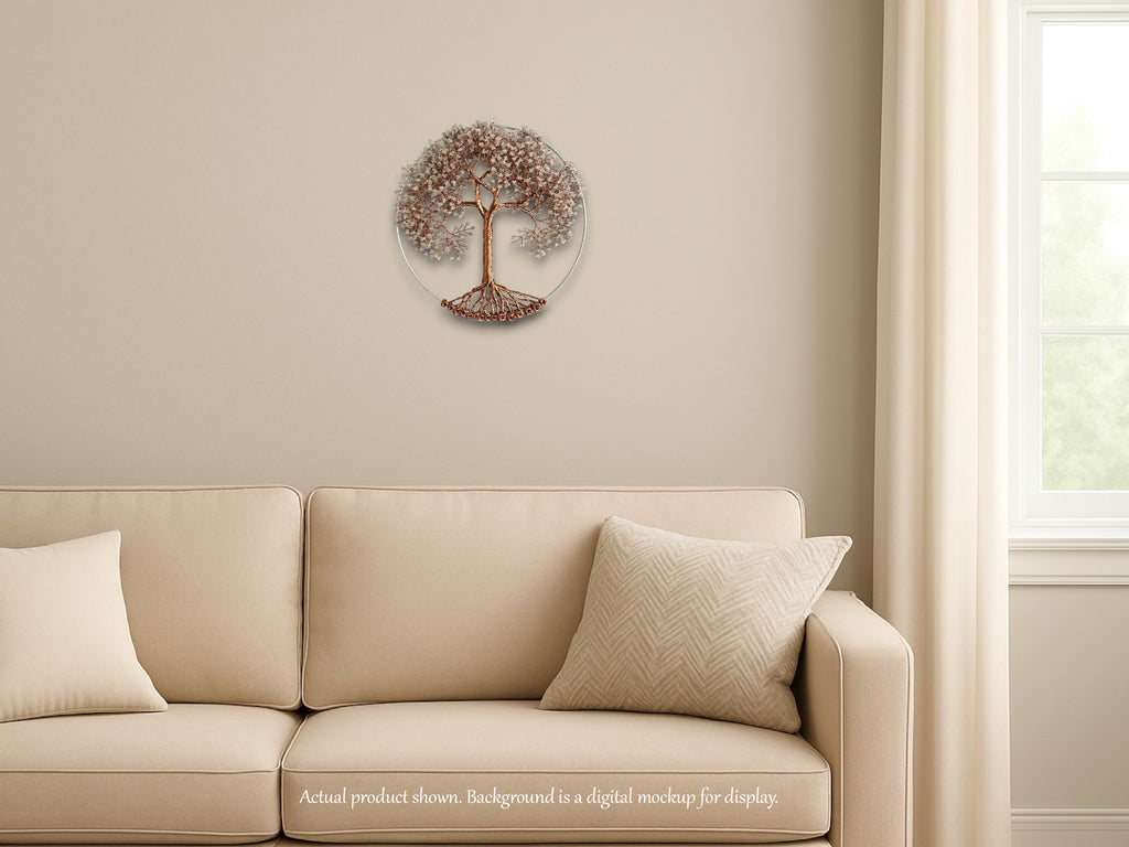Beige sofa with decorative pillows against a beige wall with a tree wall art piece.
