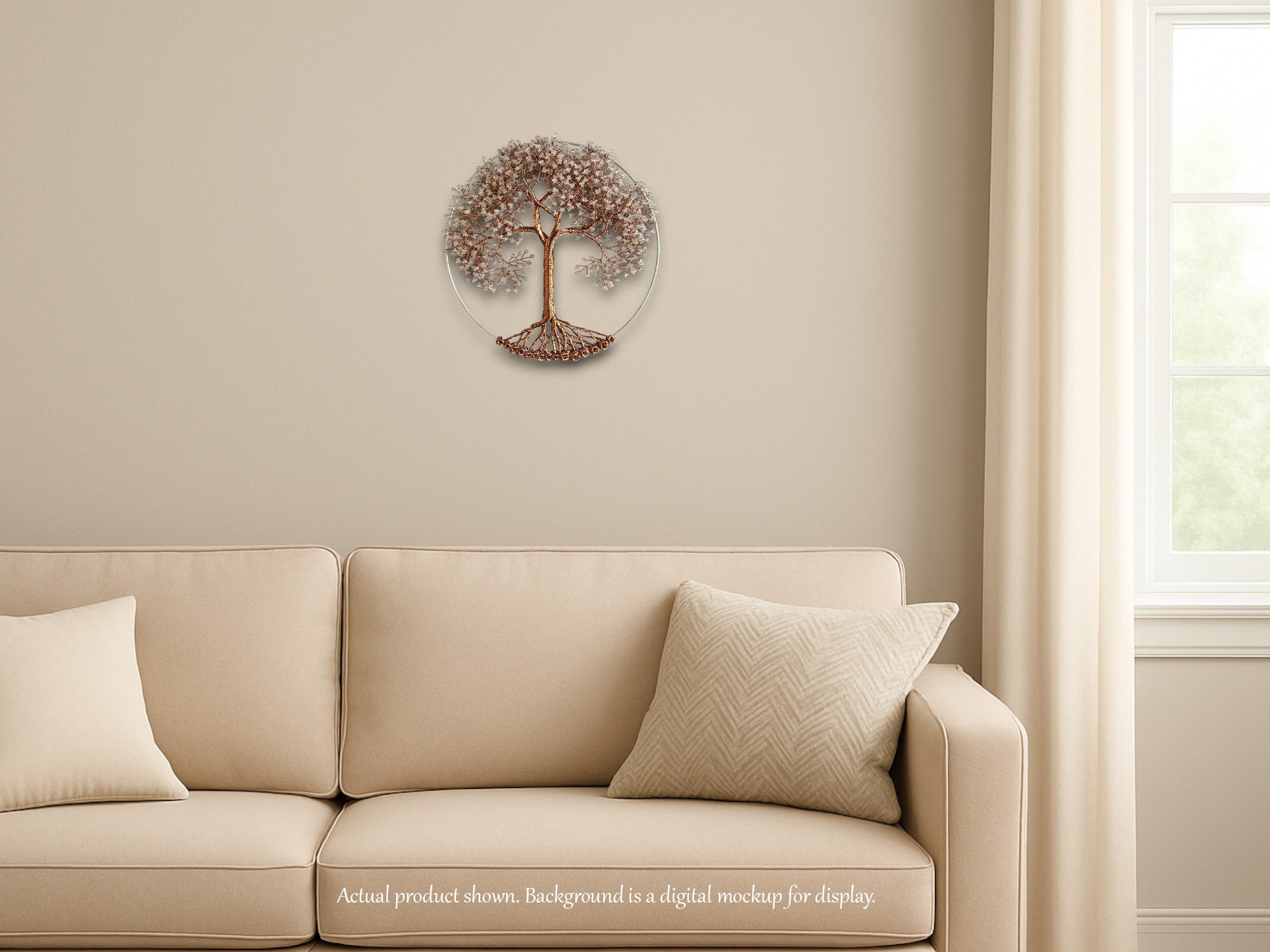 Beige sofa with decorative pillows against a beige wall with a tree wall art piece.