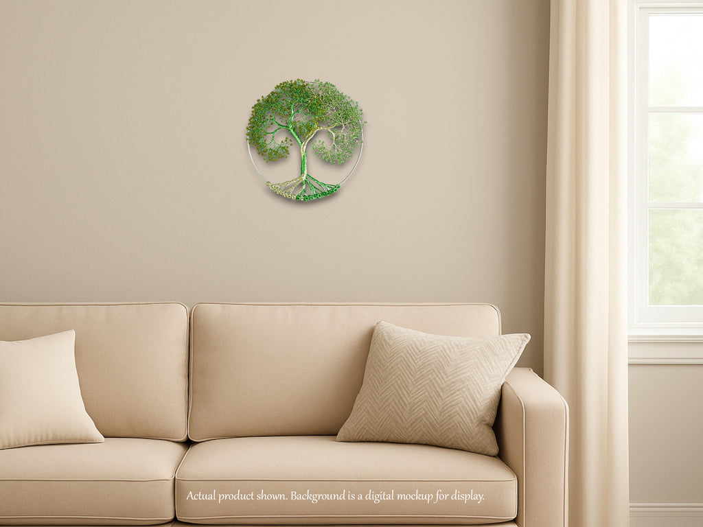 Decorative wall clock with tree design on a beige wall above a beige sofa.