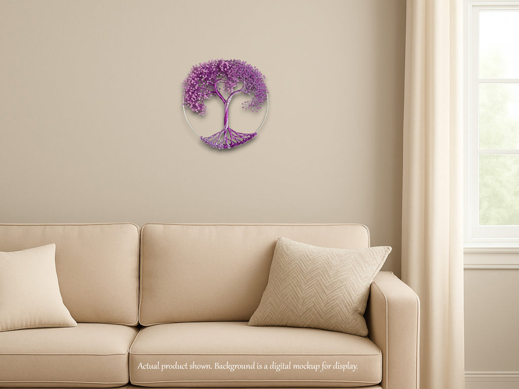Decorative purple tree wall art on a beige wall above a beige sofa.