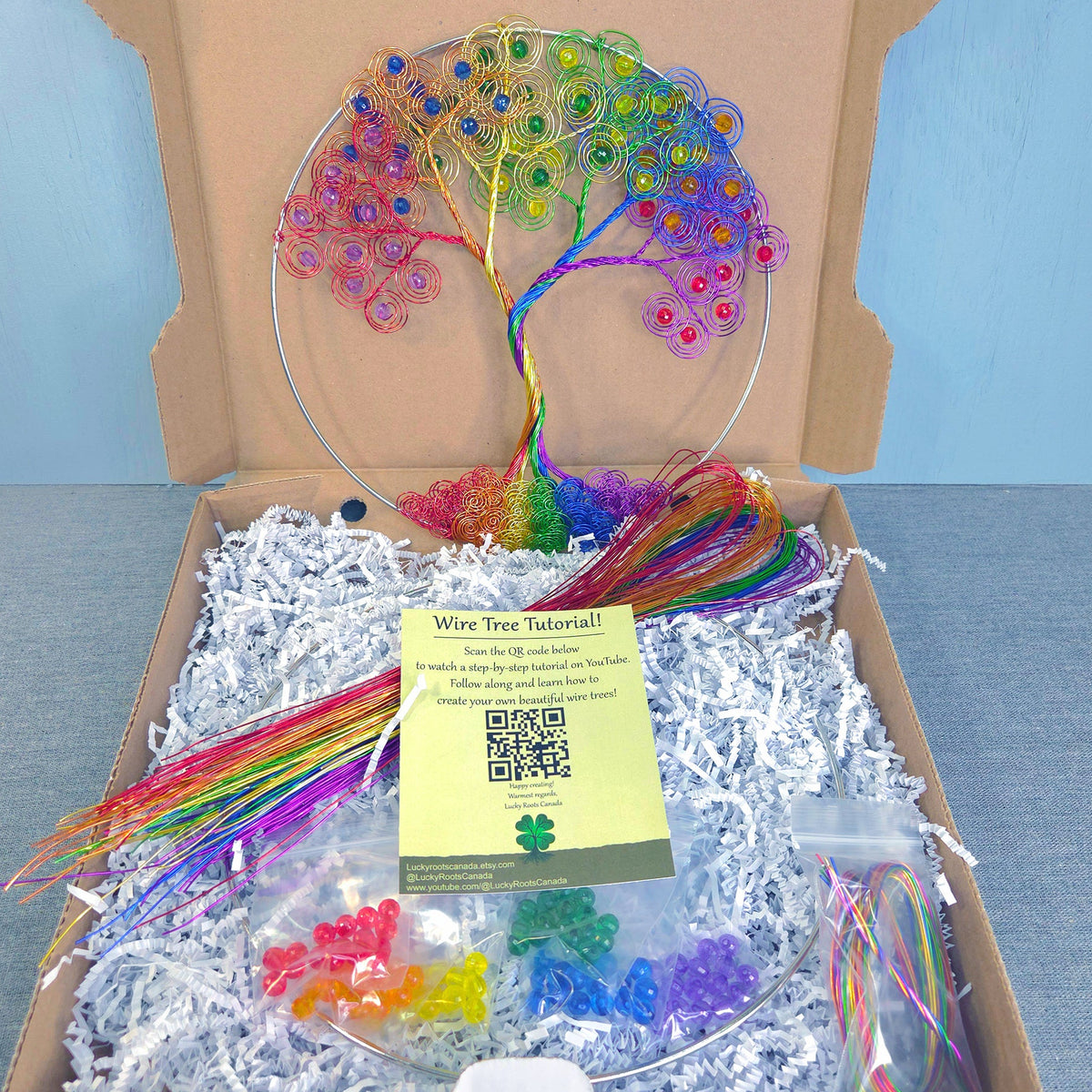 Colorful wire tree kit with materials and instructions in a cardboard box.