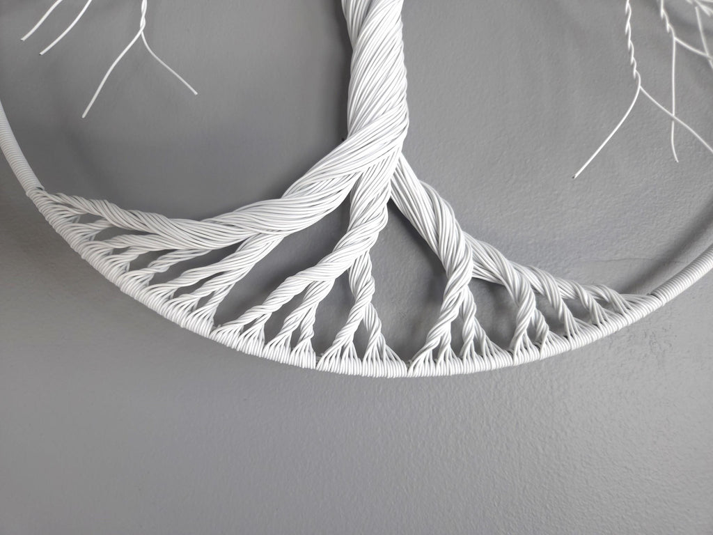 White woven circular object on a gray background